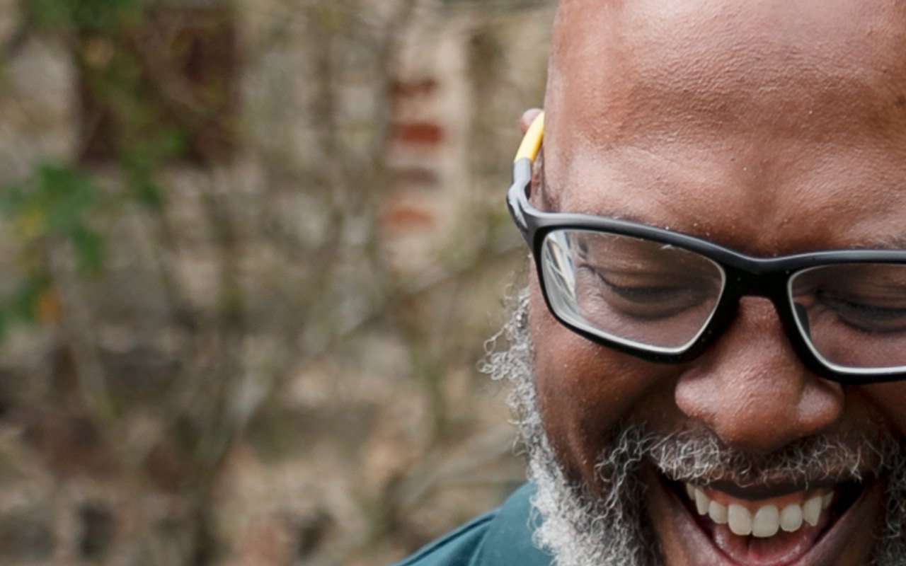 Mature man laughing outdoors — male pelvic health physical therapy in Knoxville